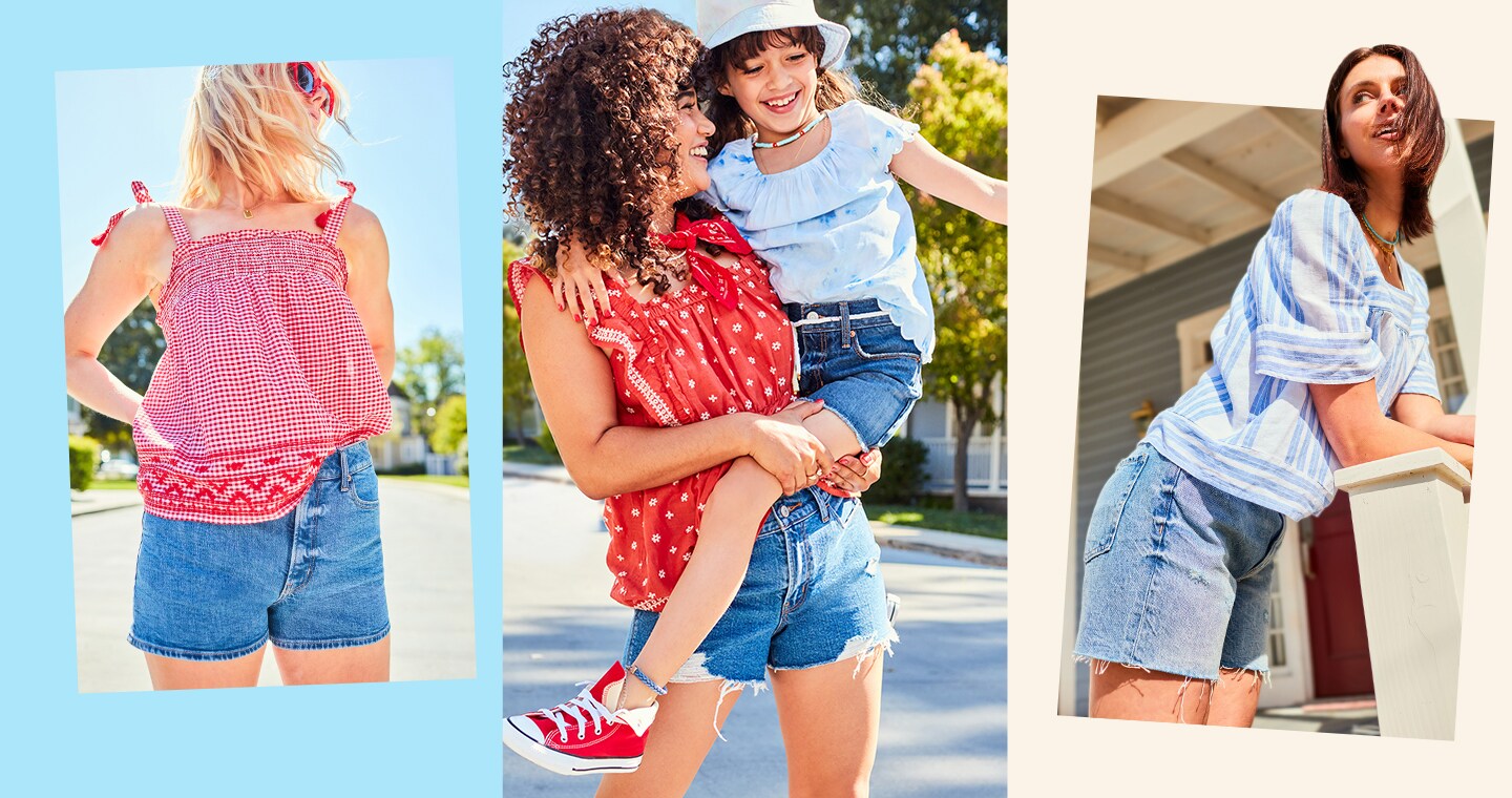 A female model dressed in dark wash denim cut-off shorts and a red top holding a younger model wearing matching shorts and a light blue ruffled blouse.