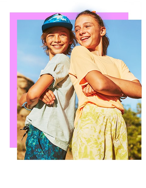 Two models dressed in slouchy summer tees. 