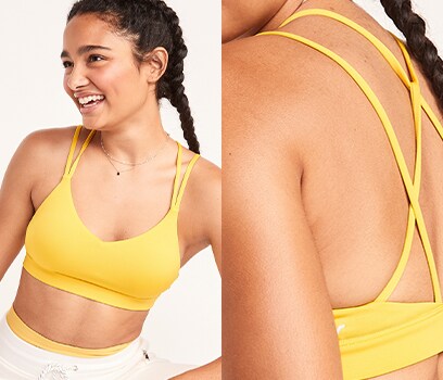 A model wears a yellow light support strappy V-neck sports bra