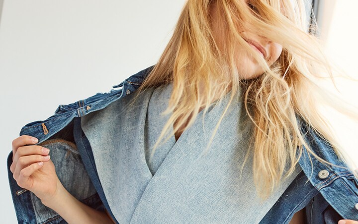 Image of a model draped in sustainable denim fabrics
