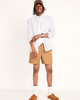 A male model wears a long-sleeve twill striped button-up shirt & light brown Twill Built-In Flex Jogger Shorts for Men