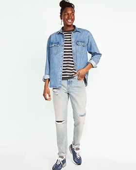 A male model wears Original Taper style denim and a long sleeve denim button up shirt over a black & white horizontal t-shirt.