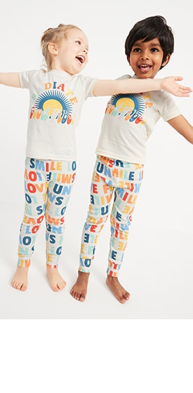 Two young models wearing matching pajama sets.