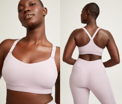 Female model wearing medium support adjustable strap sports bra.