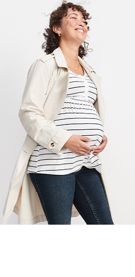 A female model wearing a maternity Long-Sleeve Luxe Peplum-Hem Henley Top