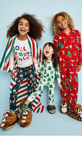 Three models wearing Old Navy jingle jammies in various colors and prints.