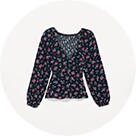 A floral pattern Puff-Sleeve Smocked Wrap Blouse.