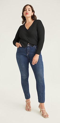 Model in heathered dark blue skinny jeans.