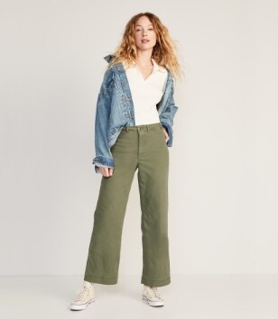 A model in a pair of green colored Chino Crop Wide Leg pants.