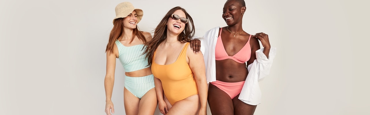 Three female models wear swimsuits from Old Navy's collection in different colors and styles.