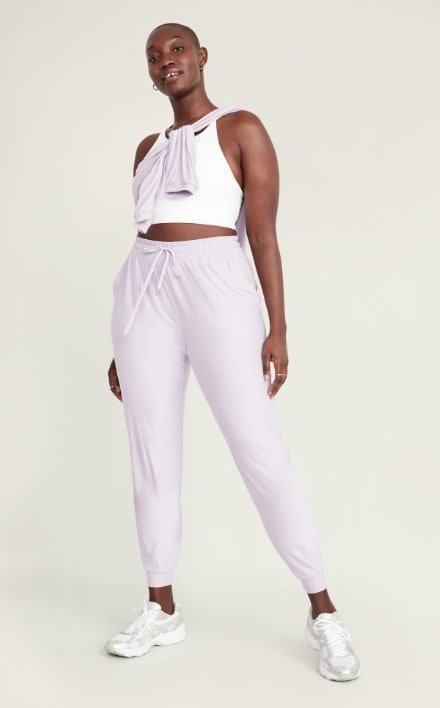 A female model wearing light colored Cloud 94 Soft style activewear pants