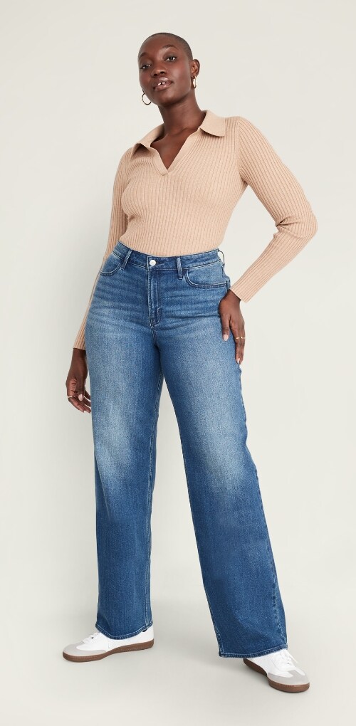 A female wearing wow wide leg jean and long sleeve rib knit top.