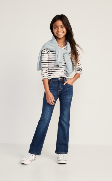 A young model wearing mini flare boot-cut jean.