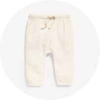 Image features unisex beige double-weave cinched-hem jogger sweatpants for baby.