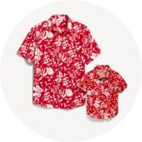 Matching father and son red and white floral print dress shirts.