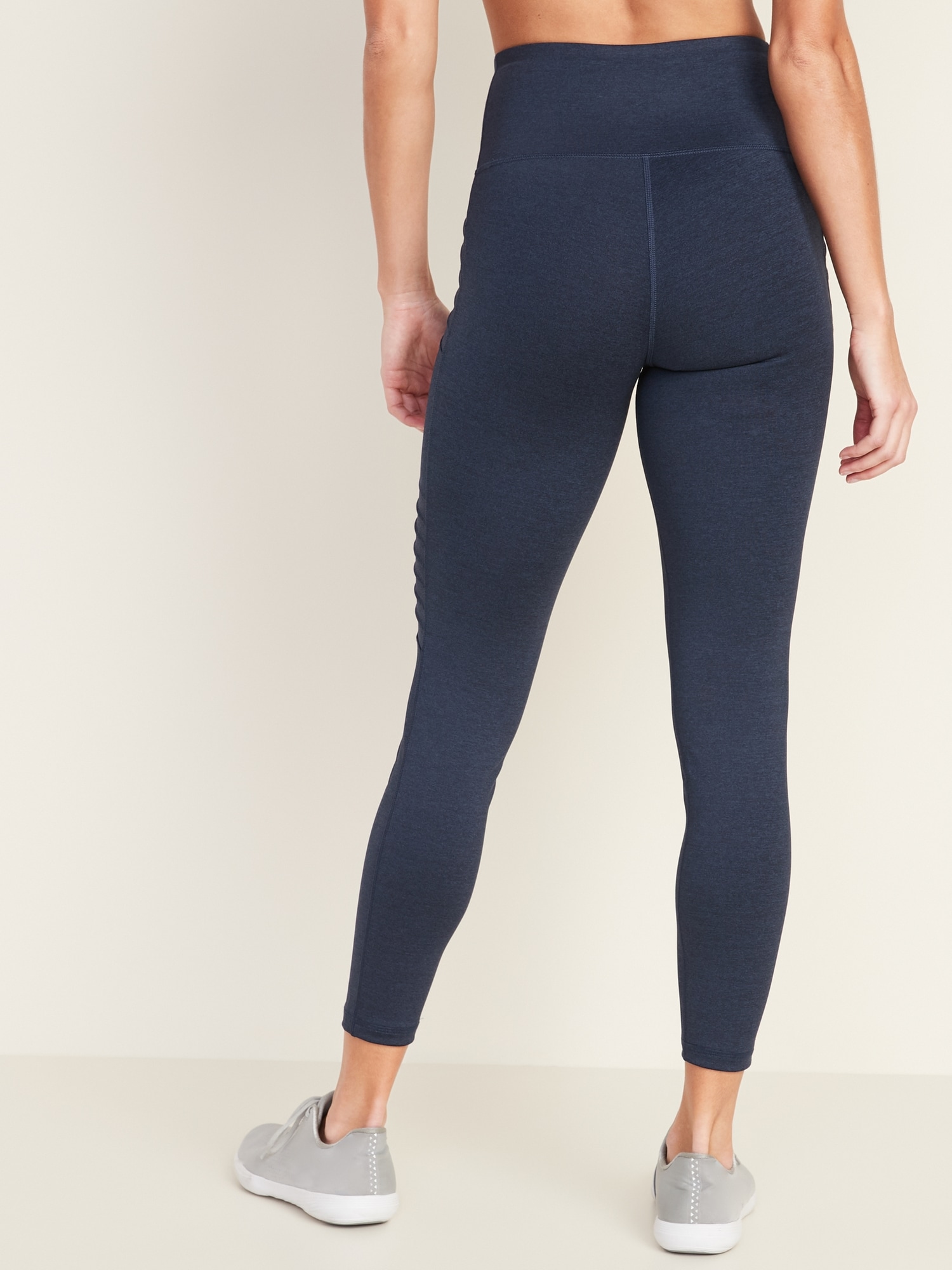 Navy blue, moto leggings with no front or back pockets. 68% cotton, 27%  polyester, and 5% spandex. Sold in packs of six - one small, two mediums,  two larges, one extra large.