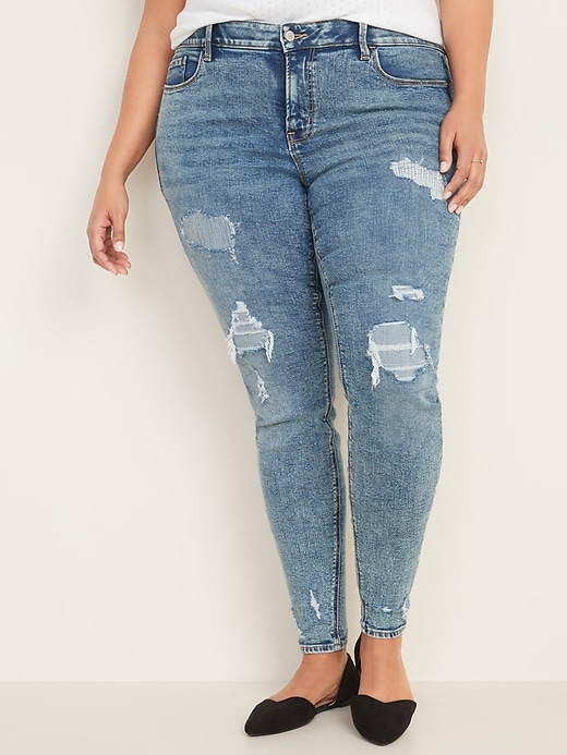 Image number 1 showing, High-Waisted Secret-Slim Pockets + Waistband Distressed Rockstar Jeans