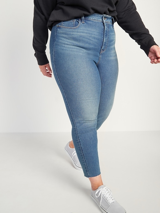 Image number 1 showing, Extra High-Waisted Secret-Slim Pockets Rockstar 360° Stretch Super Skinny Plus-Size Cut-Off Jeans