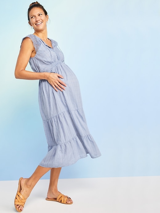 View large product image 1 of 1. Maternity Waist-Defined Crochet-Sleeve Tie-Neck Midi Dress