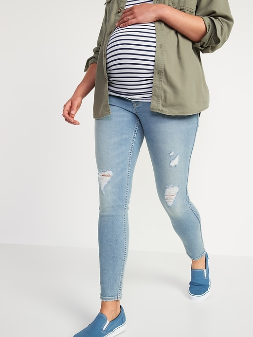 Image number 1 showing, Maternity Rollover-Waist Rockstar 360° Stretch Super Skinny Ripped Jeans