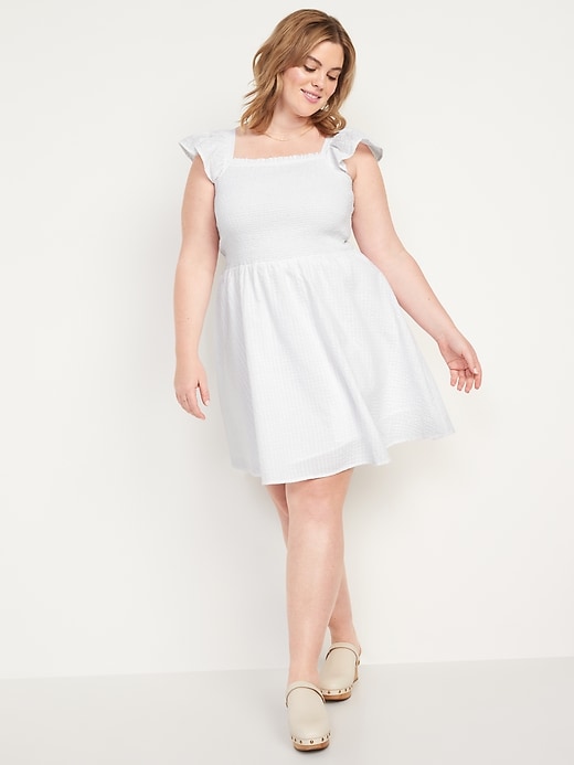 Image number 7 showing, Fit & Flare Flutter-Sleeve Smocked Seersucker Mini Dress for Women