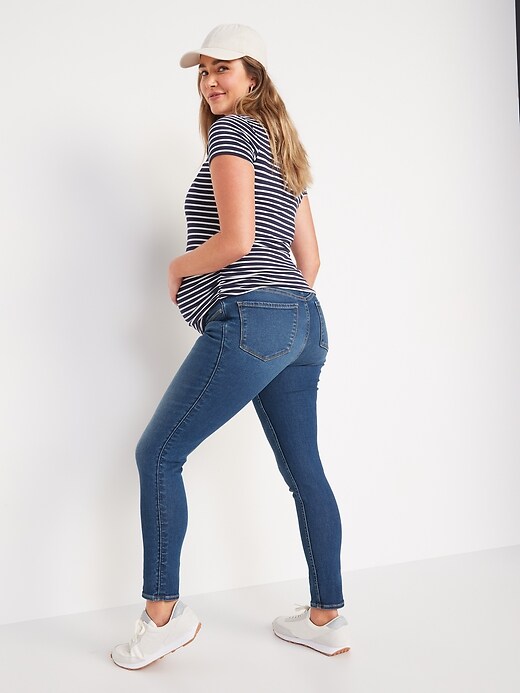 Image number 2 showing, Maternity Rollover-Waist Rockstar 360° Stretch Super Skinny Jeans