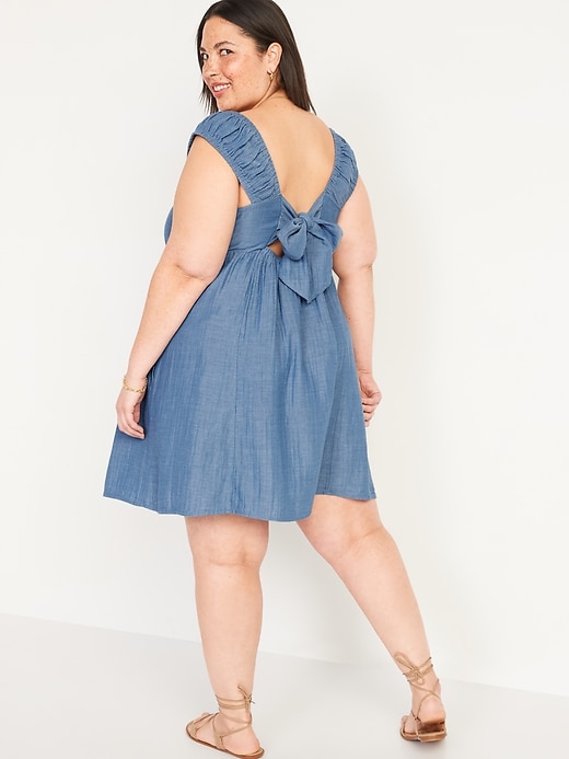 Image number 8 showing, Cap-Sleeve Chambray Cutout Bow-Detailed Mini Swing Dress for Women