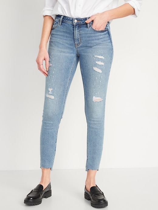 Image number 1 showing, Mid-Rise Rockstar Super-Skinny Ripped Cut-Off Ankle Jeans