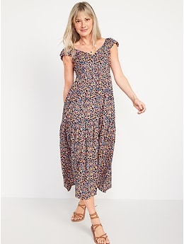 a woman wearing a fun floral print fit and flare maxi dress with pockets