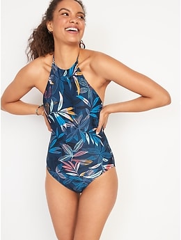 a woman wearing a tropical print halter swimsuit
