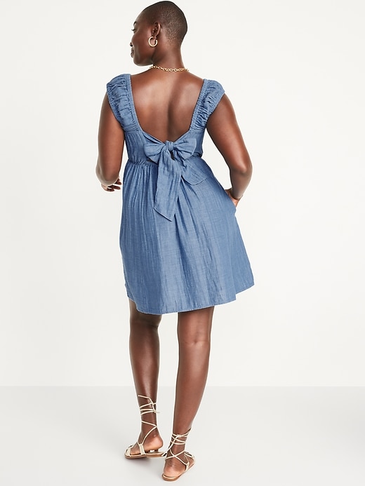 Image number 6 showing, Cap-Sleeve Chambray Cutout Bow-Detailed Mini Swing Dress for Women