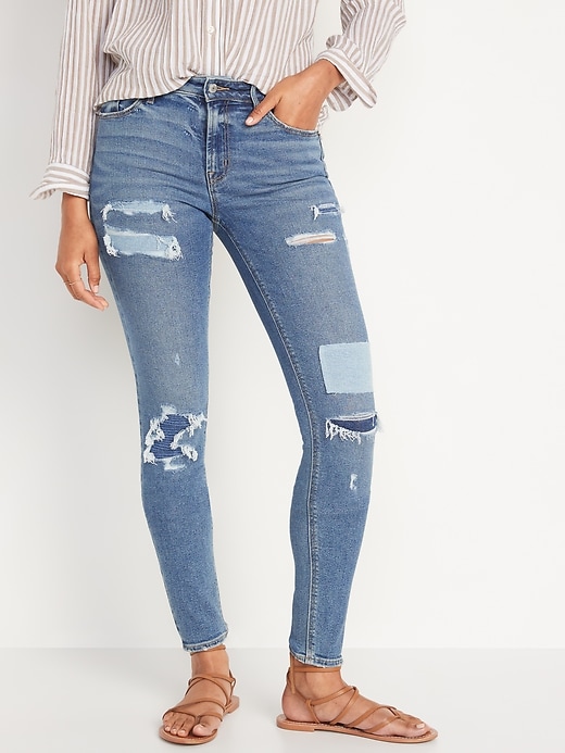 Image number 1 showing, Mid-Rise Rockstar Super-Skinny Patchwork Ripped Jeans for Women