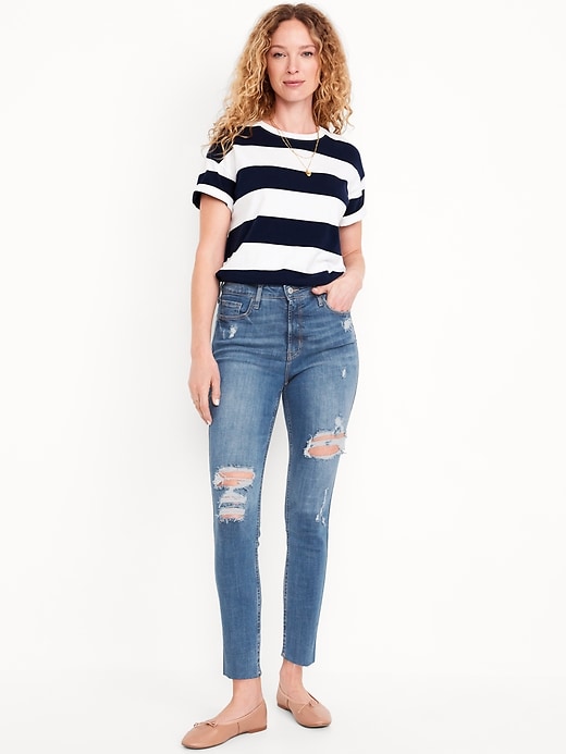 Image number 1 showing, Extra High-Waisted Rockstar 360° Stretch Super-Skinny Ripped Jeans