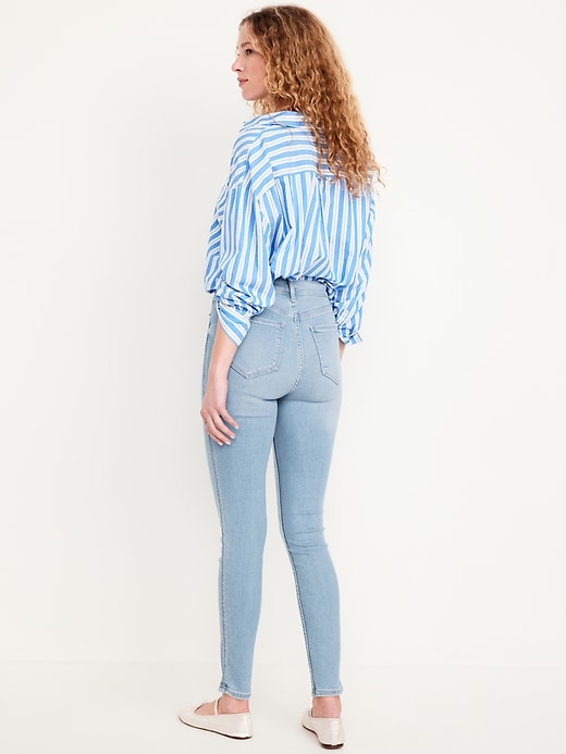 Image number 3 showing, Extra High-Waisted Rockstar 360° Stretch Super-Skinny Ankle Jeans