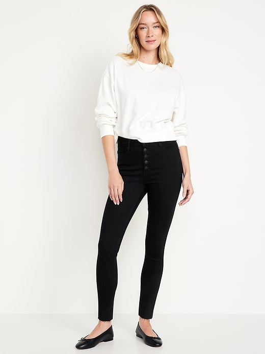 Image number 1 showing, Extra High-Waisted Button-Fly Rockstar 360° Stretch Super-Skinny Cropped Cut-Off Jeans