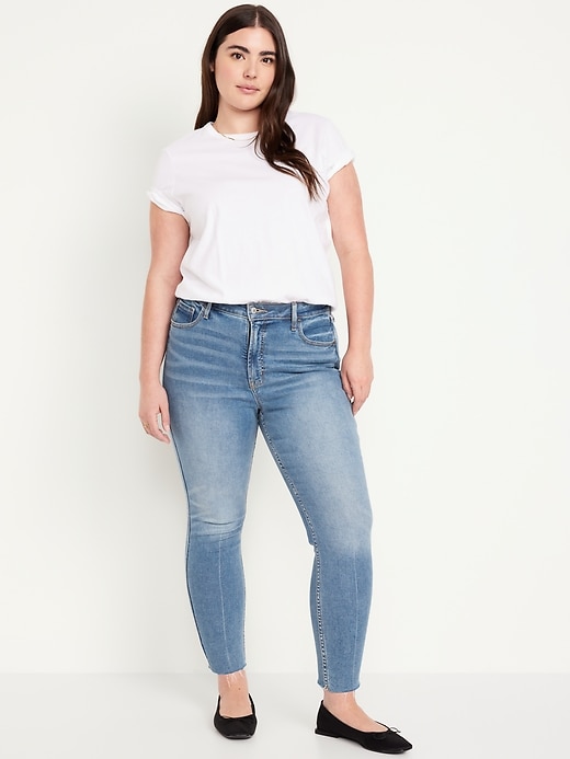 Image number 5 showing, Extra High-Waisted Rockstar 360° Stretch Super-Skinny Cut-Off Ankle Jeans