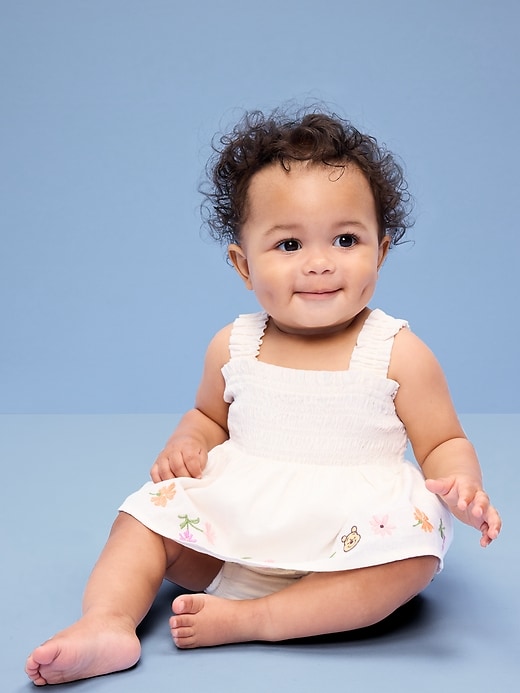 Image number 1 showing, Old Navy x Disney Winnie the Pooh Smocked Skirt One-Piece for Baby