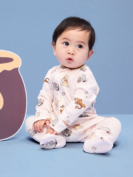 Image number 1 showing, Old Navy x Disney Winnie the Pooh 2-Way-Zip Sleep & Play Footed One-Piece for Baby