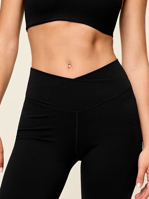 Image number 4 showing, Crossover-Waist StudioSmooth Flare Leggings